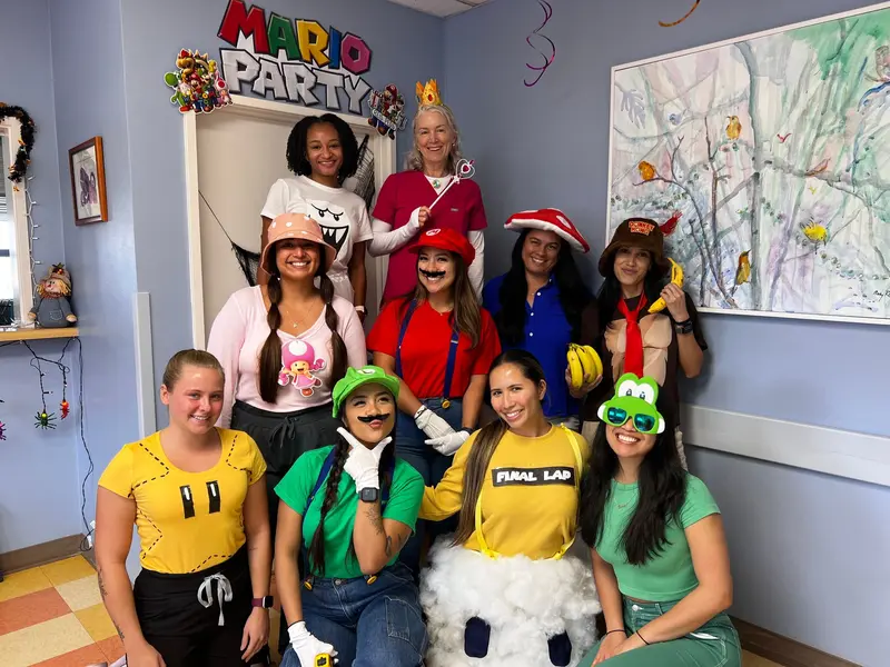 Reis Pediatrics staff in costume in the office
