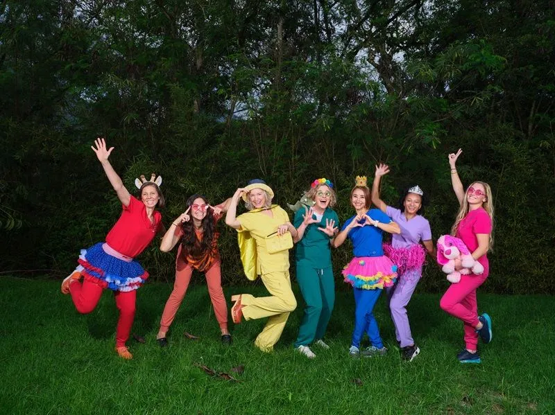 Reis Pediatrics providers jumping in rainbow scrubs